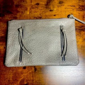 Gray large clutch with tassels and zippers